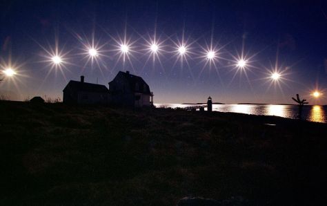 The sun, nearing winter solstice, travels low across the sky in a multiple-exposure picture made in Maine in 2002.