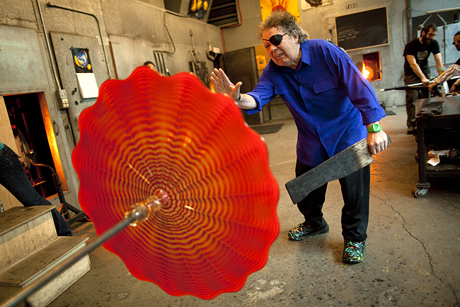 Seattle glass Artist Dale Chihuly puts the finishing touches on a piece of glass at his studio in Seattle on Wednesday, January 26, 2011. (CREDIT: Mike Kane for the Boston Globe)