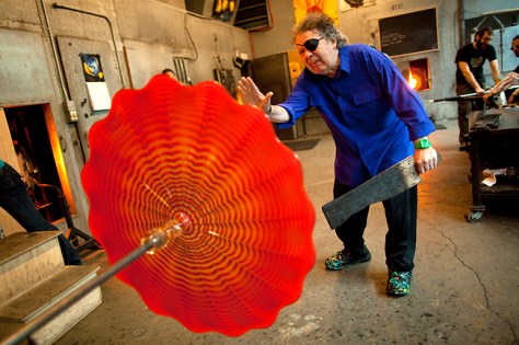 Seattle glass Artist Dale Chihuly puts the finishing touches on a piece of glass at his studio in Seattle on Wednesday, January 26, 2011. (CREDIT: Mike Kane for the Boston Globe)